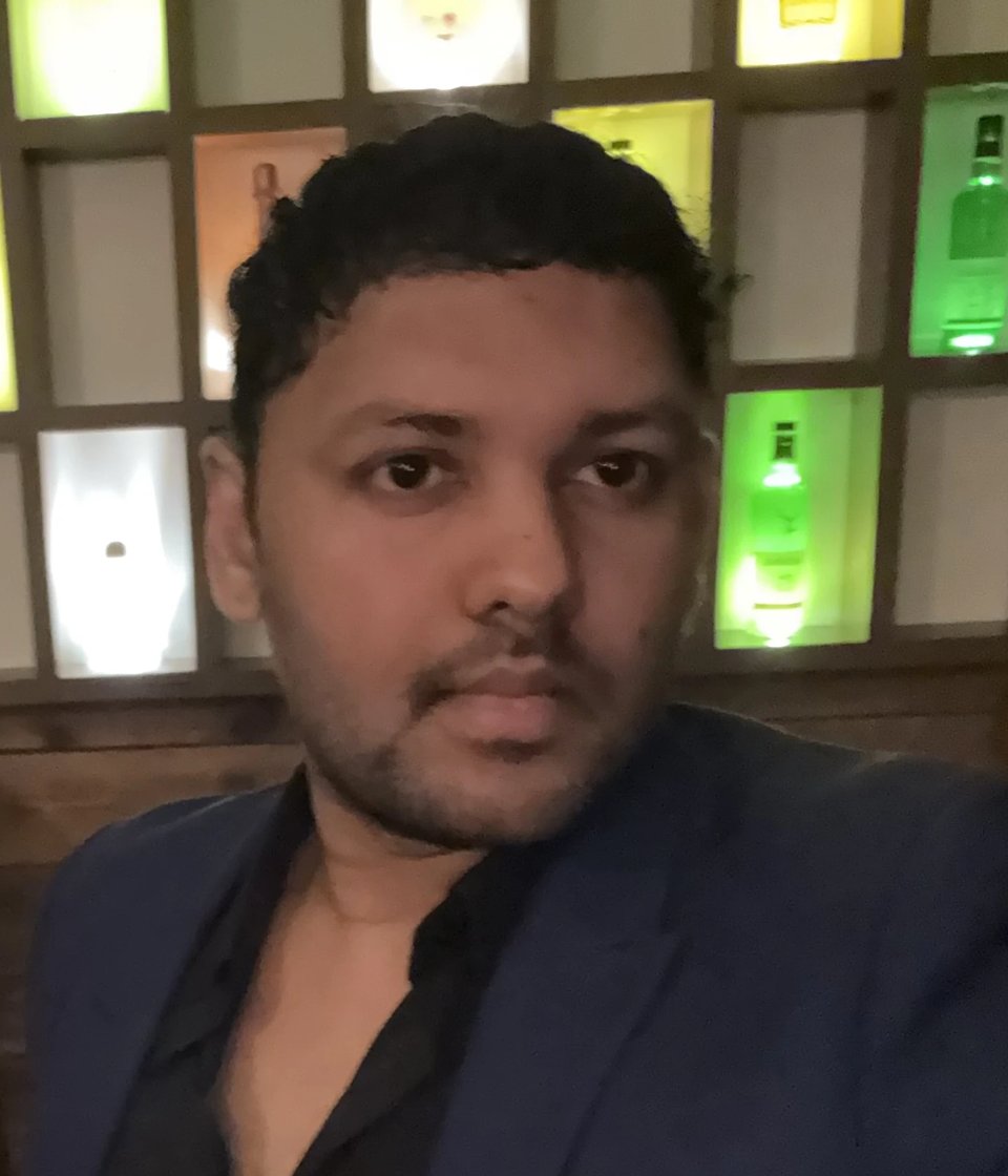 Portrait of Nikhilesh Ravi, Founder of Axiom Talent Management
